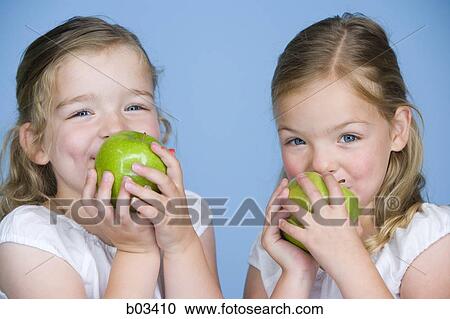 Girls with green apples View Large Photo Image Stock Image - Girls with green apples. Fotosearch