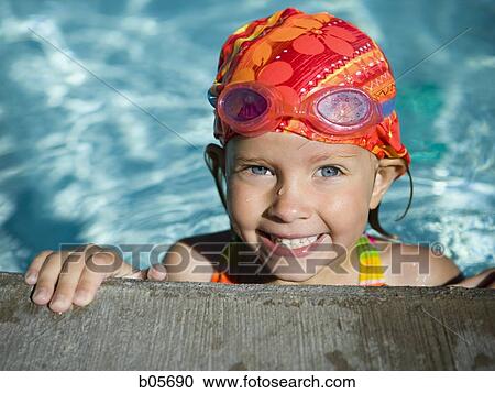 Little girl in a pool View Large Photo Image Stock Image - Little girl in a pool. Fotosearch