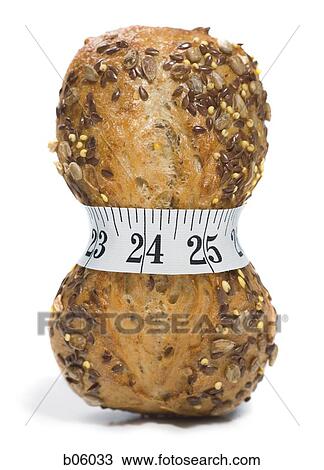 Loaf of bread with a measuring tape around it View Large Photo Image Stock Image - Loaf of bread with a measuring tape around it. Fotosearch