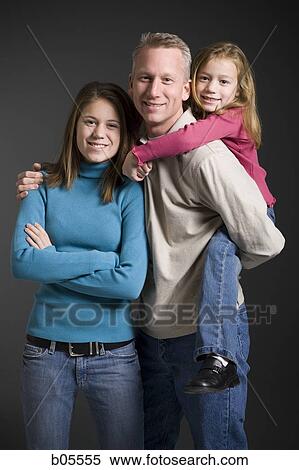 Male and two females posing View Large Photo Image Stock Photography - Male and two females posing. Fotosearch