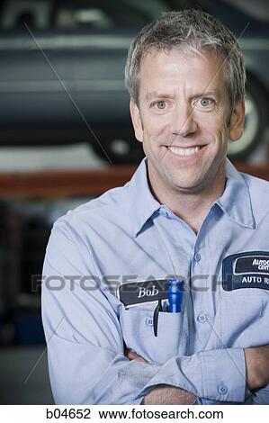 Stock Image - Male auto shop worker. Fotosearch