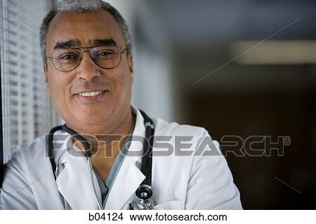 Male doctor smiling View Large Photo Image Picture - Male doctor smiling. Fotosearch