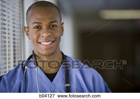 Male doctor smiling View Large Photo Image Stock Photo - Male doctor smiling. Fotosearch