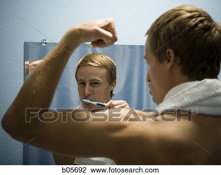 Male grooming himself View Large Photo Image Stock Image - Male grooming himself. Fotosearch