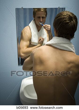 Male grooming himself View Large Photo Image Stock Image - Male grooming himself. Fotosearch