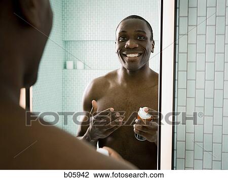 Male grooming himself View Large Photo Image Stock Image - Male grooming himself. Fotosearch