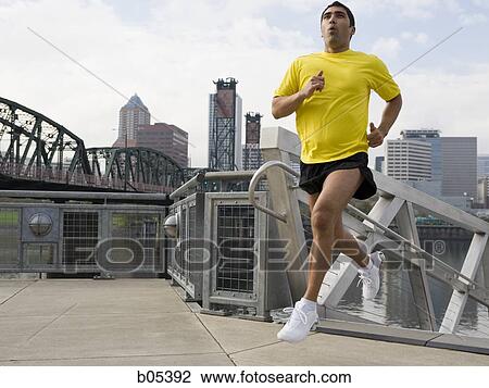 Male jogger in city View Large Photo Image Stock Image - Male jogger in city. Fotosearch