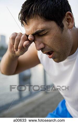 Stock Image - Male jogger resting. Fotosearch