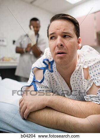 Male patient waiting for examination View Large Photo Image Picture - Male patient waiting for examination. Fotosearch
