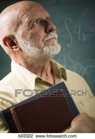 Male school teacher with books View Large Photo Image Stock Image - Male school teacher with books. Fotosearch