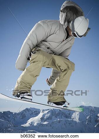 Stock Image - Male snowboarder. Fotosearch