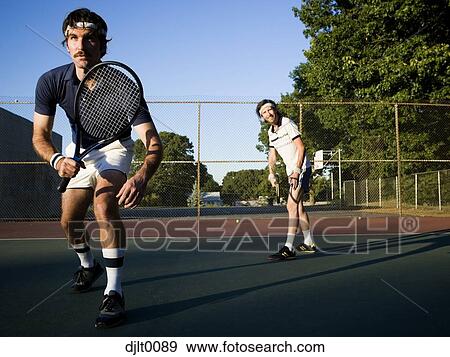 Stock Photo - Male Tennis Players on the court. Fotosearch