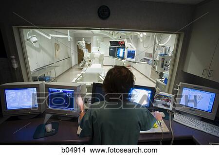 Male x-ray technician sitting at computers View Large Photo Image Picture - Male x-ray technician sitting at computers. Fotosearch