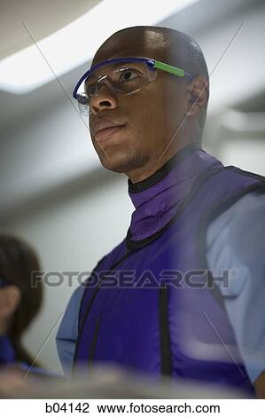 Male x-ray technician wearing protective glasses View Large Photo Image Stock Image - Male x-ray technician wearing protective glasses. Fotosearch