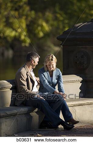 Man and woman in park View Large Photo Image Stock Image - Man and woman in park. Fotosearch