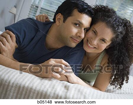 Man and woman on bed snuggling View Large Photo Image Stock Photo - Man and woman on bed snuggling. Fotosearch