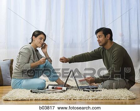 Man and woman on carpet with laptops View Large Photo Image Stock Photo - Man and woman on carpet with laptops. Fotosearch
