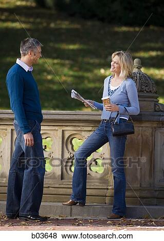 Stock Photo - Man and woman smiling. Fotosearch