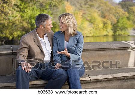 Man and woman talking View Large Photo Image Stock Image - Man and woman talking. Fotosearch