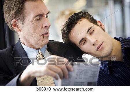 Man asleep on another man's shoulder on city bus or subway View Large Photo Image Stock Image - Man asleep on another man's shoulder on city bus or subway. Fotosearch