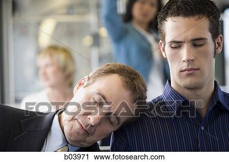 Man asleep on another man's shoulder on city bus or subway View Large Photo Image Stock Image - Man asleep on another man's shoulder on city bus or subway. Fotosearch