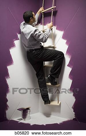 Man climbing a ladder View Large Photo Image Stock Image - Man climbing a ladder. Fotosearch
