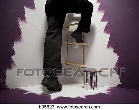 Man climbing a ladder View Large Photo Image Stock Image - Man climbing a ladder. Fotosearch