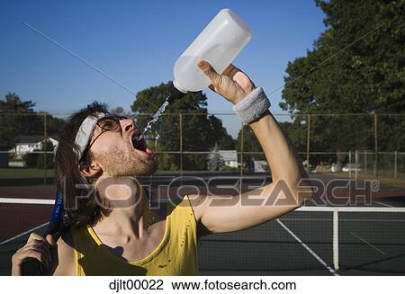 Man drinking water View Large Photo Image Stock Image - Man drinking water. Fotosearch