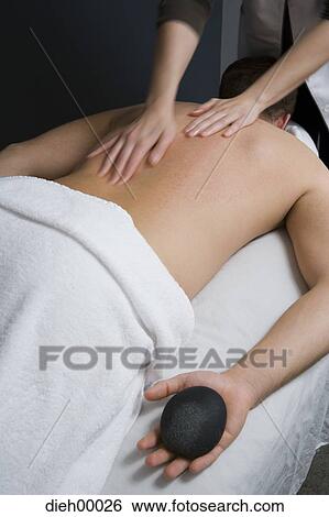 Stock Photograph - Man having a back massage. Fotosearch