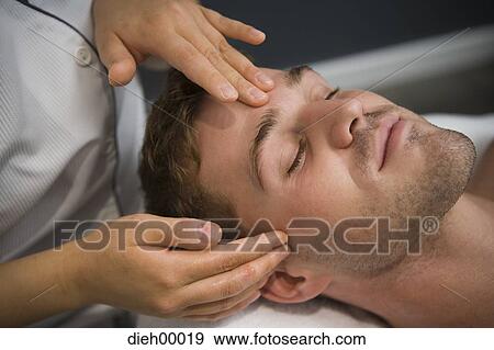 Stock Photo - Man having a facial. Fotosearch