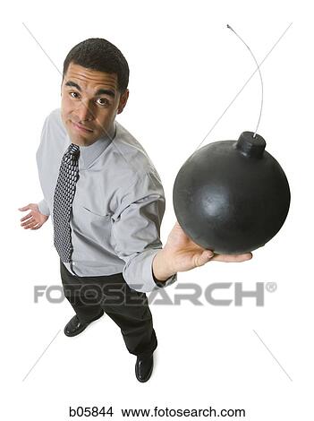 Man holding a cannonball View Large Photo Image Picture - Man holding a cannonball. Fotosearch