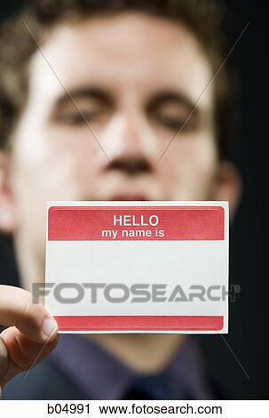 Man holding blank name tag View Large Photo Image Stock Image - Man holding blank name tag. Fotosearch