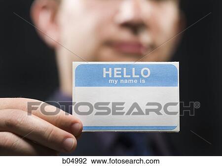 Man holding blank name tag View Large Photo Image Stock Image - Man holding blank name tag. Fotosearch