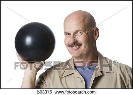 Man holding bowling ball View Large Photo Image Stock Photograph - Man holding bowling ball. Fotosearch