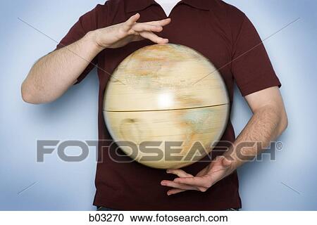 Man holding globe View Large Photo Image Stock Image - Man holding globe. Fotosearch