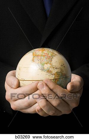 Man holding globe View Large Photo Image Stock Photo - Man holding globe. Fotosearch