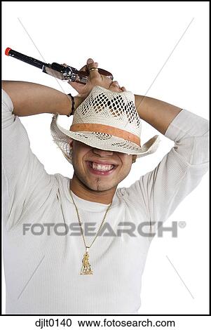 Man in straw cowboy hat with toy gun View Large Photo Image Stock Image - Man in straw cowboy hat with toy gun. Fotosearch