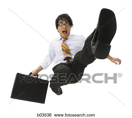 Stock Photograph - Man jumping with briefcase. Fotosearch
