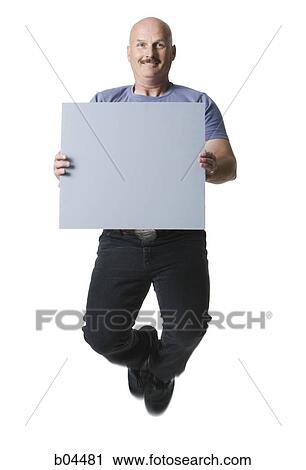 Man leaping with blank sign View Large Photo Image Stock Image - Man leaping with blank sign. Fotosearch