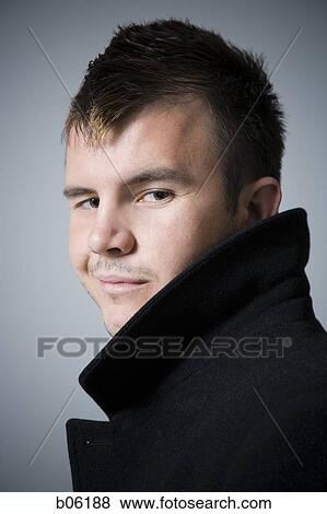 Man looking over his shoulder View Large Photo Image Stock Photo - Man looking over his shoulder. Fotosearch