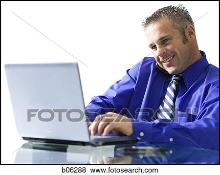 Stock Photo - Man on a laptop. Fotosearch
