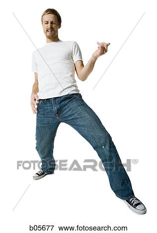 Stock Photo - Man playing air guitar. Fotosearch