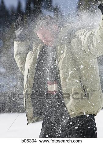 Picture - Man playing in the snow. Fotosearch