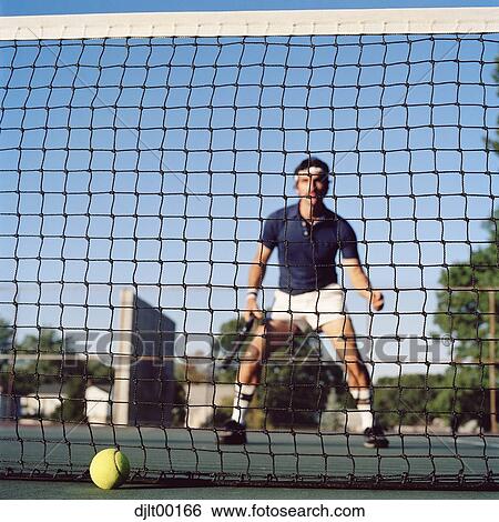 Man playing tennis View Large Photo Image Stock Photograph - Man playing tennis. Fotosearch