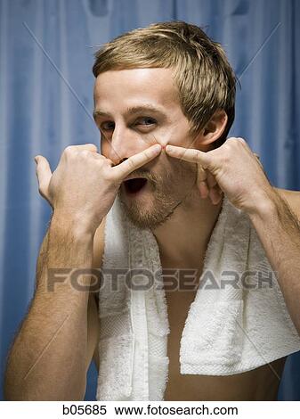 Man popping a zit View Large Photo Image Stock Photography - Man popping a zit. Fotosearch