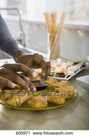 Man preparing appetizers View Large Photo Image Stock Image - Man preparing appetizers. Fotosearch