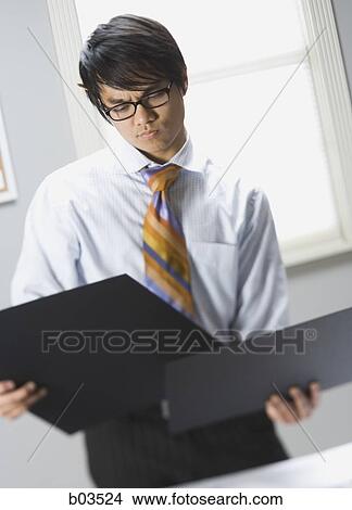Man preparing for presentation View Large Photo Image Picture - Man preparing for presentation. Fotosearch