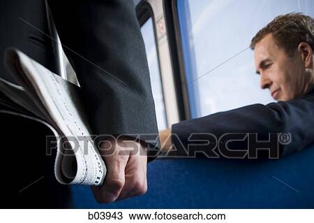 Man reading in bus or subway View Large Photo Image Stock Image - Man reading in bus or subway. Fotosearch