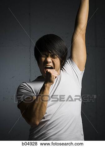 Man singing with arm up View Large Photo Image Stock Photo - Man singing with arm up. Fotosearch