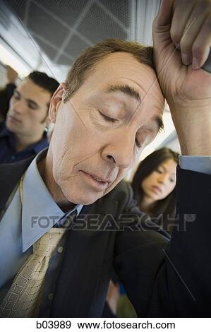 Man sleeping on city bus or subway View Large Photo Image Stock Photo - Man sleeping on city bus or subway. Fotosearch
